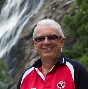 Les Williams in a natural outdoor setting, smiling and engaging in coaching at icanhelpu.ca.
